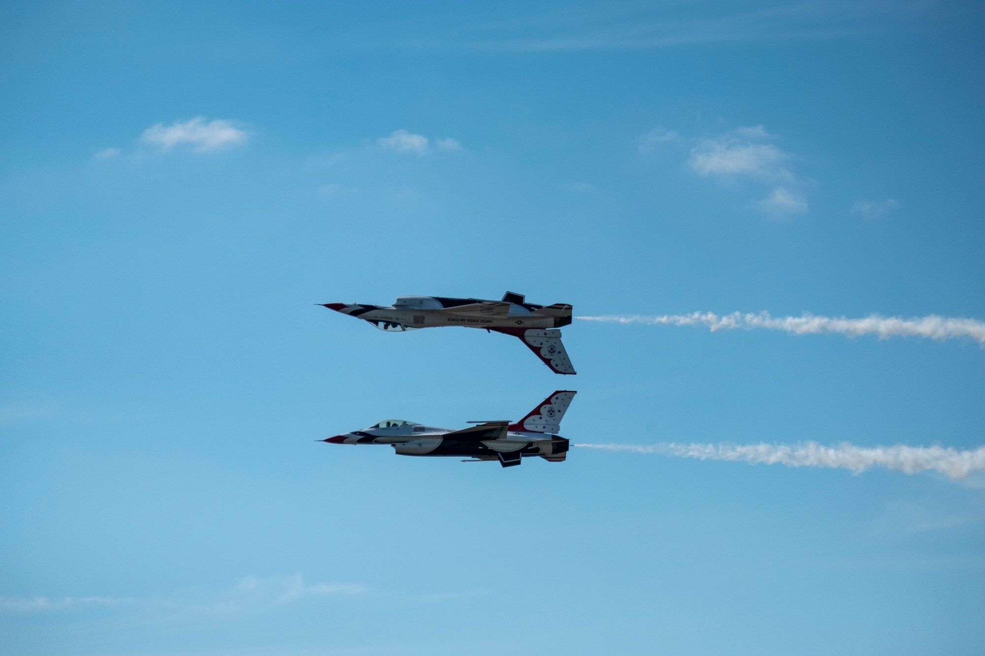 Members of the U.S. Thunderbirds perform for Team McConnell at the Frontiers in Flight Open House and Airshow Sept. 9, 2018, McConnell Air Force Base, Kan. In 1953 the Air Force activated the 3600th Demonstration Unit, which adopted the name “Thunderbirds,” establishing a 55-year heritage of displaying the capabilities of the most powerful Air Force in the world. (U.S. Air Force Photo by Staff Sgt. Preston Webb)