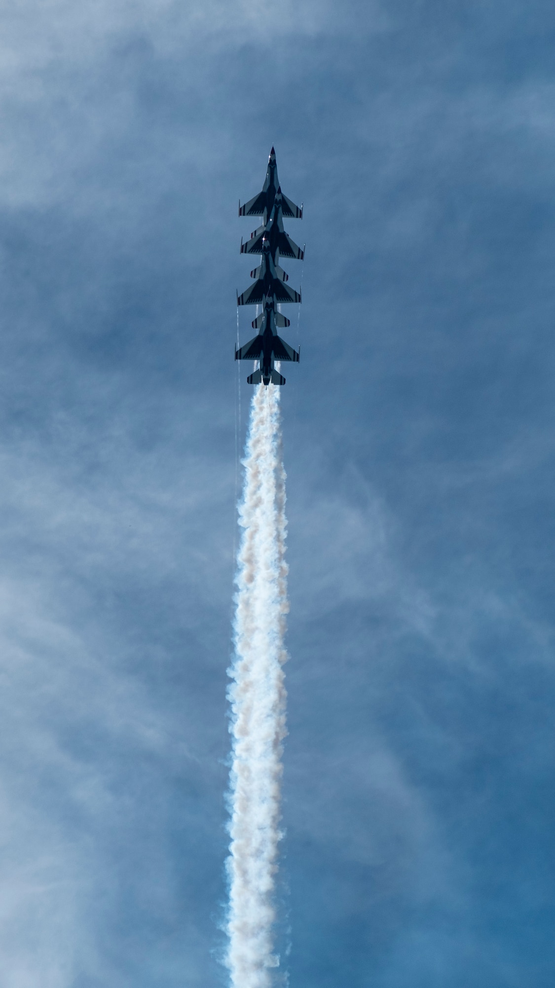 Members of the U.S. Thunderbirds perform for Team McConnell at the Frontiers in Flight Open House and Airshow Sept. 9, 2018, McConnell Air Force Base, Kan. In 1953 the Air Force activated the 3600th Demonstration Unit, which adopted the name “Thunderbirds,” establishing a 55-year heritage of displaying the capabilities of the most powerful Air Force in the world. (U.S. Air Force Photo by Staff Sgt. Preston Webb)