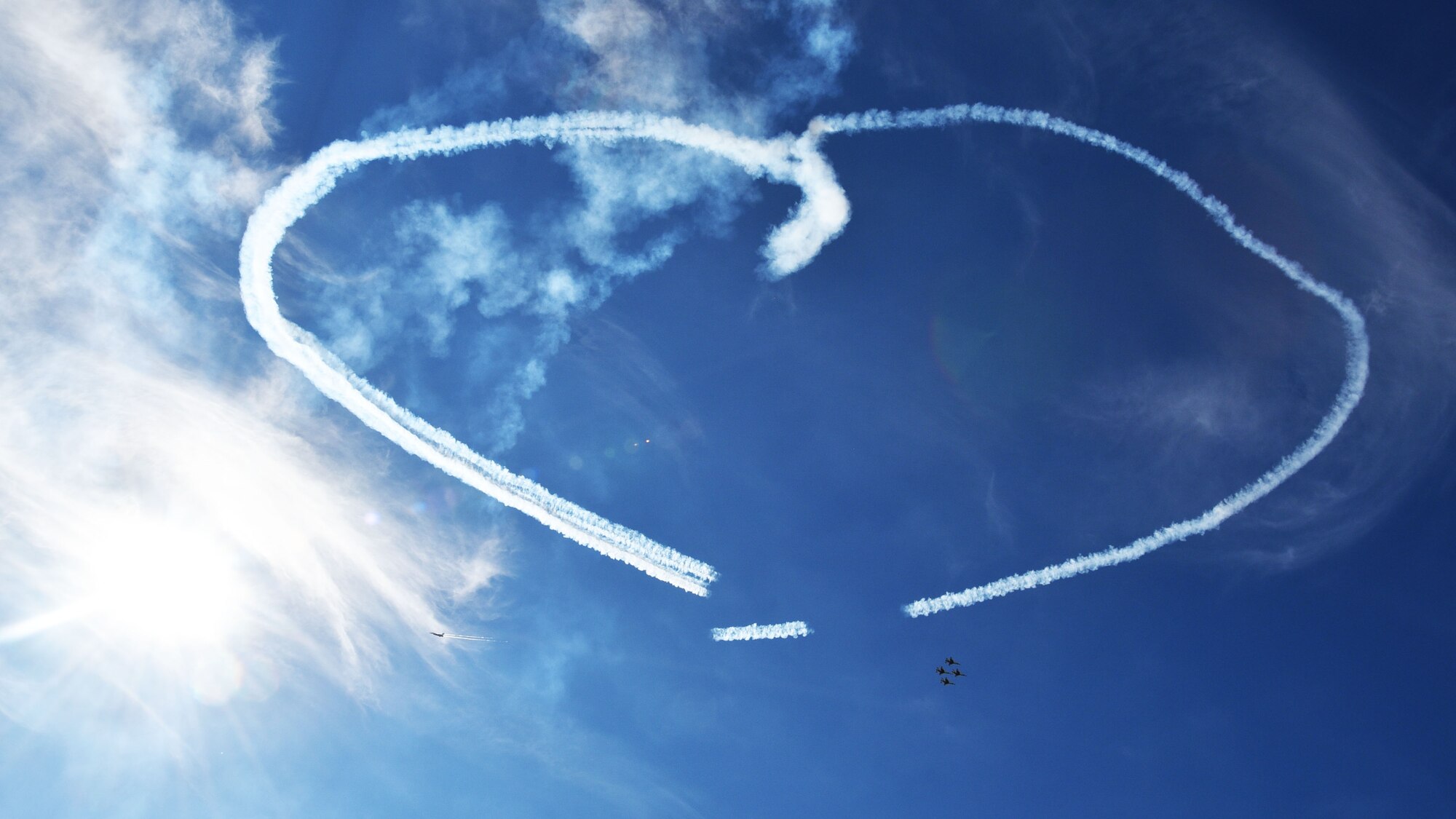 The U.S. Air Force Thunderbirds make a heart shape for the families of deployed servicemembers at the Frontiers in Flight Open House and Airshow Sept. 9, 2018, McConnell Air Force Base, Kan. This was the first performance by the team at McConnell since 2012.  (U.S. Air Force photo by Tech. Sgt. Abigail Klein)