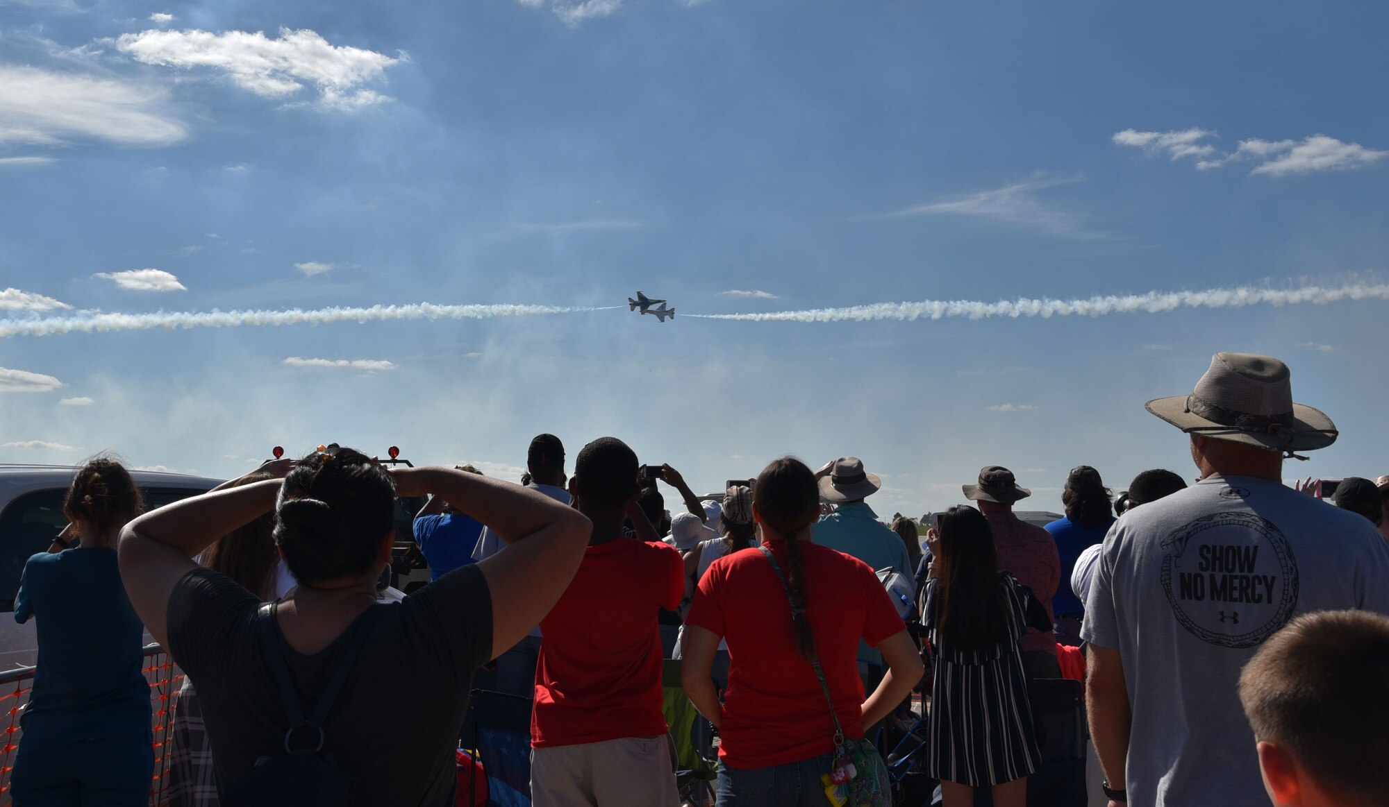 Guests watch as the he U.S. Air Force Thunderbirds perform at the Frontiers in Flight Open House and Airshow Sept. 9, 2018, McConnell Air Force Base, Kan. This was the first time the Thunderbirds had performed at McConnell since 2012.  (U.S. Air Force photo by Tech. Sgt. Abigail Klein)