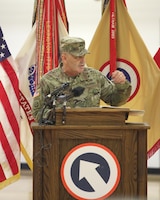 FORT KNOX, Ky - Maj. Gen Flem B. "Donnie" Walker Jr, the commanding general of 1st Theater Sustainment Command speaks at the deployment ceremony held at the Sadowski Center on post. The team, which is comprised of Soldiers and Department of the Army Civilians, deployed to Kuwait where they will assume the Strategic Operations and Plans mission. The members known as the White Team will replace the Red Team, which is scheduled to redeploy in mid December.