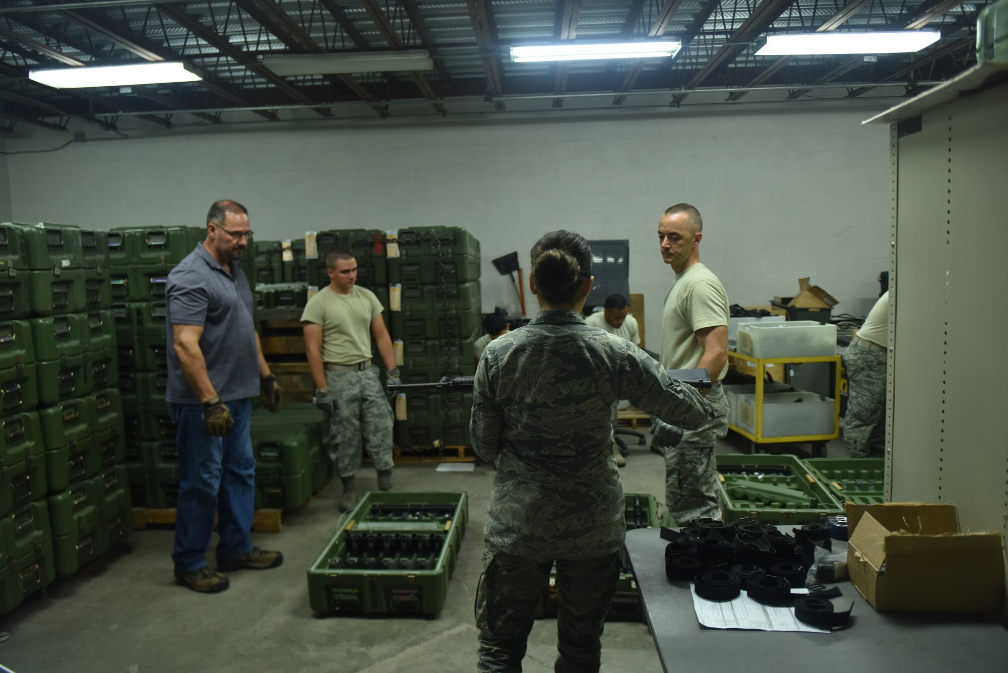 Members of the 509th Logistics Readiness Squadron at Whiteman Air Force Base, Missouri prepare to ship one of the largest small arms loads of the year.