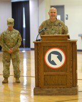 FORT KNOX, Ky - Lt. Col Allen (Larry) Pundt prays during a redeployment ceremony held here at Fort Knox. 1st TSC welcomed home 25 of its Soldiers from Kuwait at a redeployment ceremony Dec. 13 at the Sadowski Center here on post.