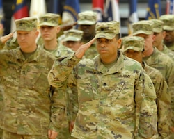 FORT KNOX, Ky - 1st Theater Sustainment Command Soldiers salute during a redeployment ceremony held here at Fort Knox. 1st TSC welcomed home 25 of its Soldiers from Kuwait at a redeployment ceremony Dec. 13 at the Sadowski Center here on post.