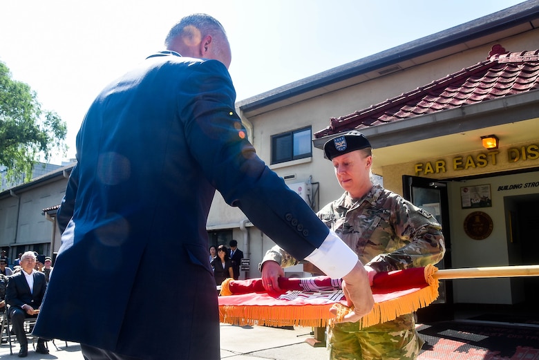 Col. Teresa Schlosser (right), U.S. Army Corps of Engineers Far East District commander, and the Honorable Seo, Yang-ho, Mayor of the Jung-gu district, honor the nation during the playing of the U.S. national anthem during a colors casing ceremony Aug. 31 to mark the closing of the district's headquarters in Seoul (Dongdaemun) and its relocation 40 miles south to Camp Humphreys.