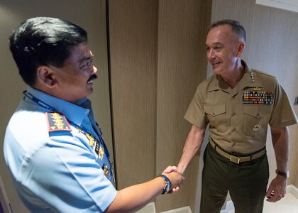 Marine Corps Gen. Joe Dunford, chairman of the Joint Chiefs of Staff, meets with Indonesian Air Force Air Chief Marshal Hadi Tjahjanto, Commander, Indonesian National Armed Forces, during the Indo-Pacific Chief of Defense conference in Waikiki, Hawaii, Sept. 10, 2018.