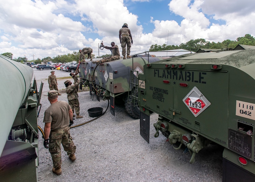 South Carolina National Guard Soldiers from the 118th Forward Support Company transfer bulk diesel fuel into M987 HEMTT fuel tanker trucks for distribution in preparation to support partnered civilian agencies and safeguard the citizens of the state in advance of Hurricane Florence, in North Charleston, South Carolina, Sept. 10, 2018.