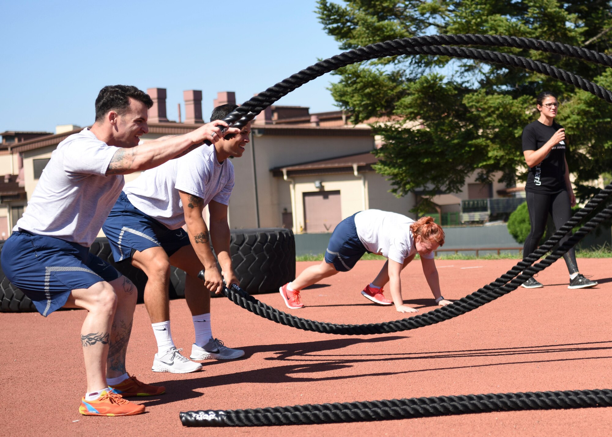 Airmen from Team Osan perform the Osprey workout during an Alpha Warrior Battle Rig instructional course at Osan Air Base, Republic of Korea, Sept. 11, 2018. The two-day course included battle rig familiarization, how to coach others on the battle rig, and how to use the battle rig with proper safety measures. (U.S. Air Force photo by Airman 1st Class Ilyana A. Escalona)
