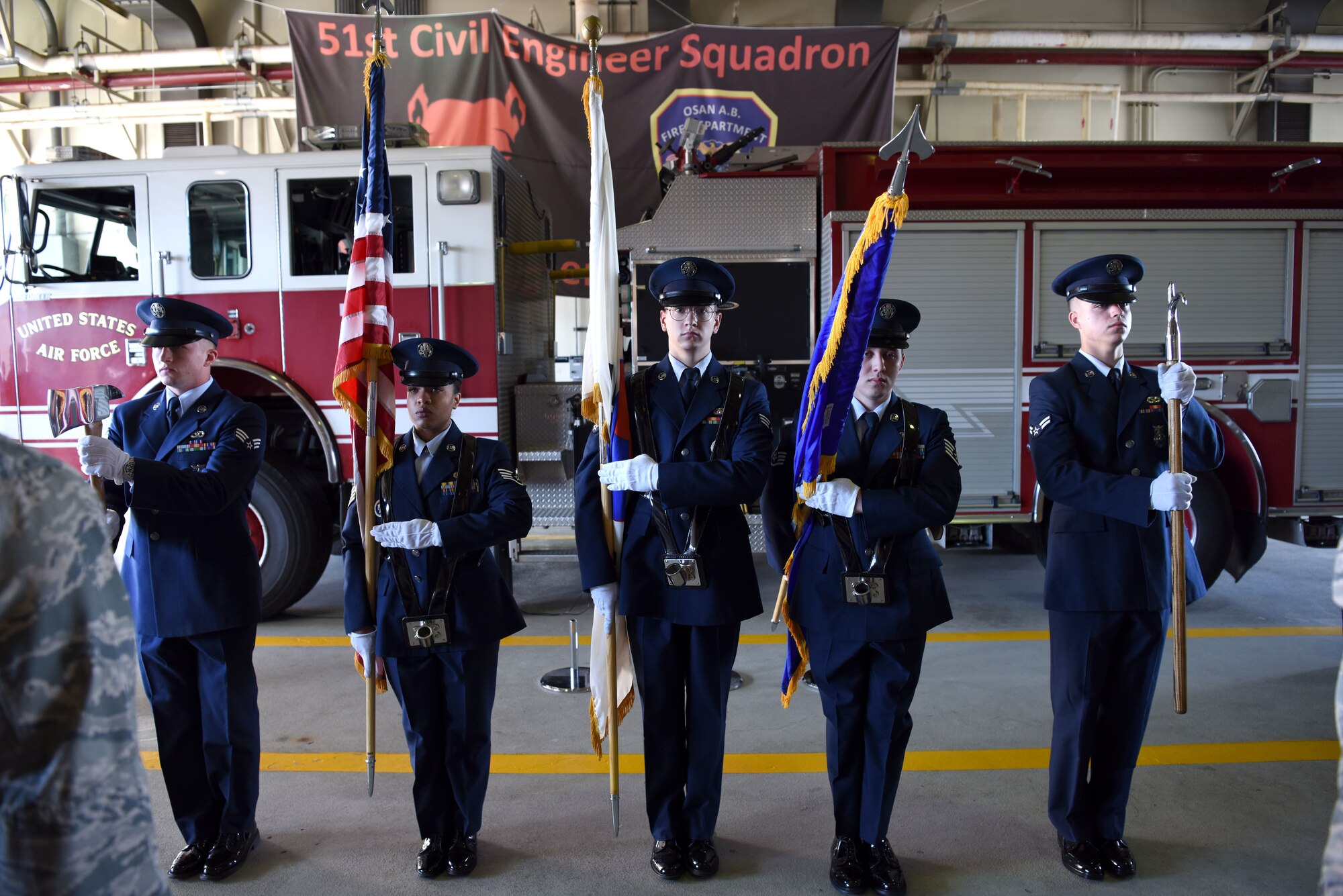 U.S Airmen with the 51st Civil Engineer Squadron honor guard present the colors during a 9/11 memorial ceremony at Osan Air Base, Republic of Korea, Sept. 11, 2018. The ceremony was held to honor the 412 first responders who lost their lives rescuing others at the World Trade Center in New York City. (U.S. Air Force photo by Senior Airman Kelsey Tucker)