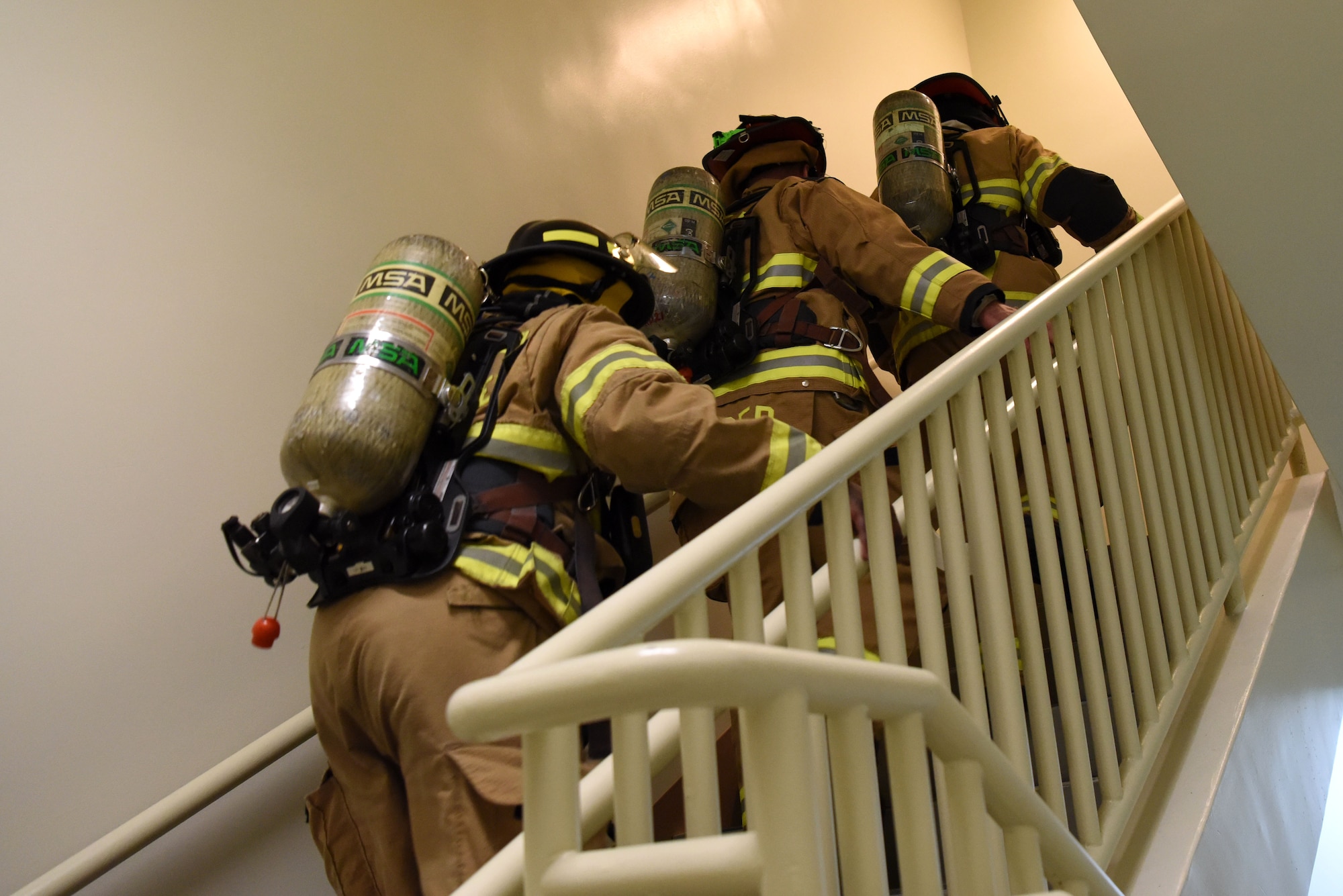 U.S. Air Force firefighters with the 51st Civil Engineer Squadron walk up a flight of stairs during a 9/11 memorial stair climb at Osan Air Base, Republic of Korea, Sept. 11, 2018. The stair climb was intended to honor those emergency responders who gave their lives saving others at the World Trade Center in New York City. (U.S. Air Force photo by Senior Airman Kelsey Tucker)