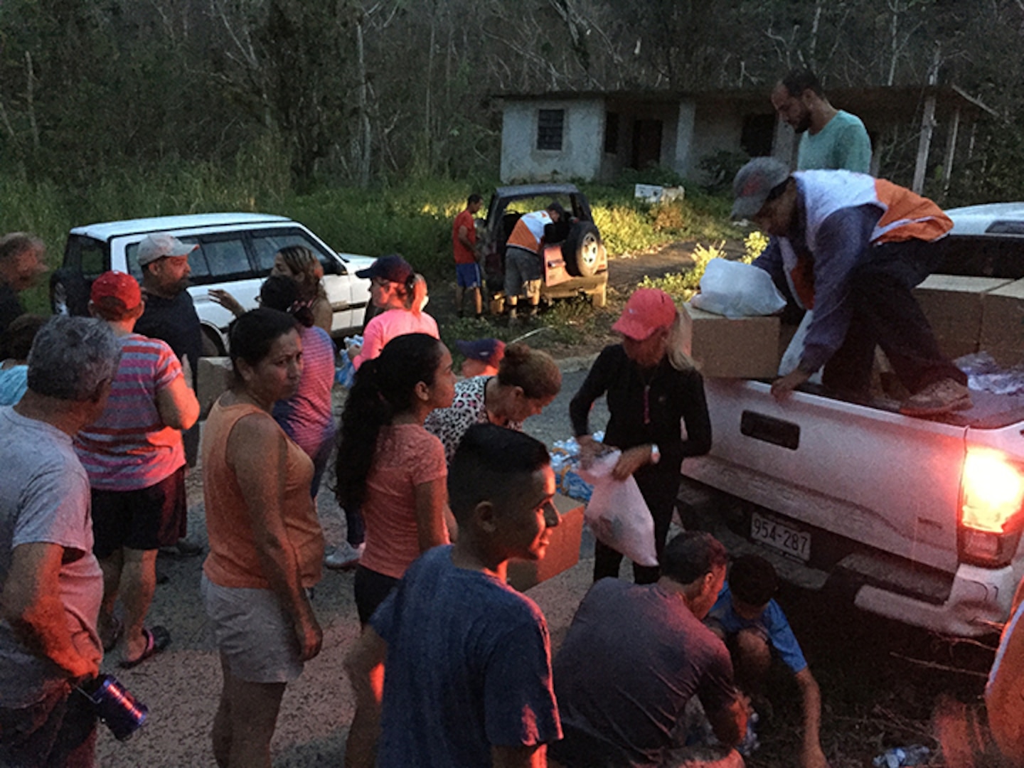 Richard Dessert, a Washington Air National Guard master sergeant, unloads emergency kits to residents in a remote mountain areas in Puerto Rico Oct. 5, 2017. On its current track, Hurricane Isaac is expected to bypass the island.