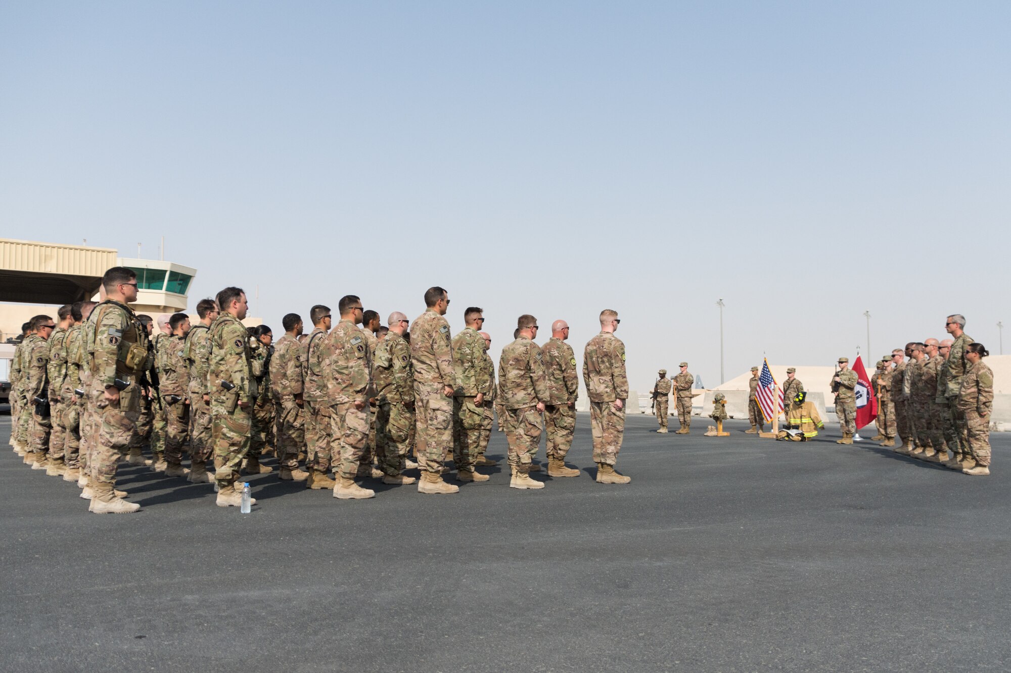 Members of the 379th Air Expeditionary Wing participate in a remembrance ceremony marking the 17th anniversary of the 9/11 terrorist attacks held at Al Udeid Air Base, Qatar, Sept. 11, 2018. The ceremony brought together the various emergency responder career fields represented on base to honor the sacrifices made on 9/11. (U.S. Air Force photo by Tech. Sgt. Ted Nichols/Released)