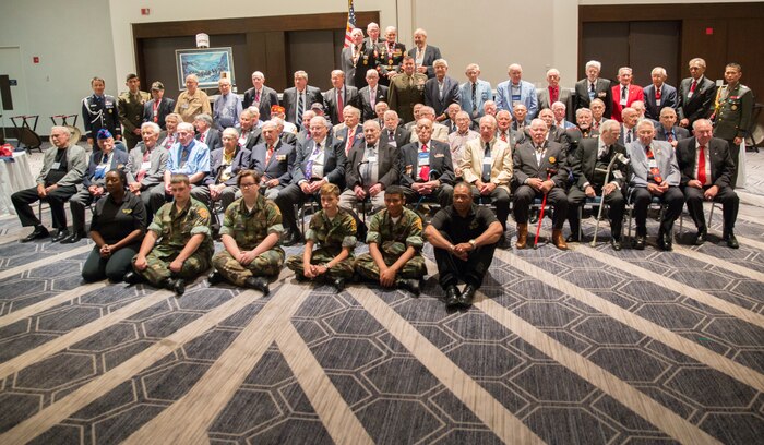 Brig. Gen. Michael S. Cederholm, Deputy Commander, U.S. Marine Corps Forces Command, speaks before veterans of the Battle of the Chosin Reservoir and their families during a reunion in Norfolk, Va., Sept. 8. Cederholm thanked them for their service and assured them the Marines who follow in their footsteps carry on the same values today. 'The Chosin Few' gather together annually to pay respects to their fallen brothers and to share stories of their experiences during the Korean War. (Official U.S. Marine Corps photo by Chris Jones/Released)