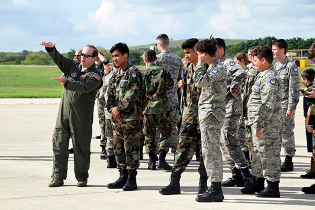 U.S. Air Force Capt. Mike Blakley, 68th Airlift Squadron pilot, describes C-5M Super Galaxy aircraft functions to Civil Air Patrol cadets during a tour at Joint Base San Antonio-Lackland, Texas, Sept. 8, 2018.
