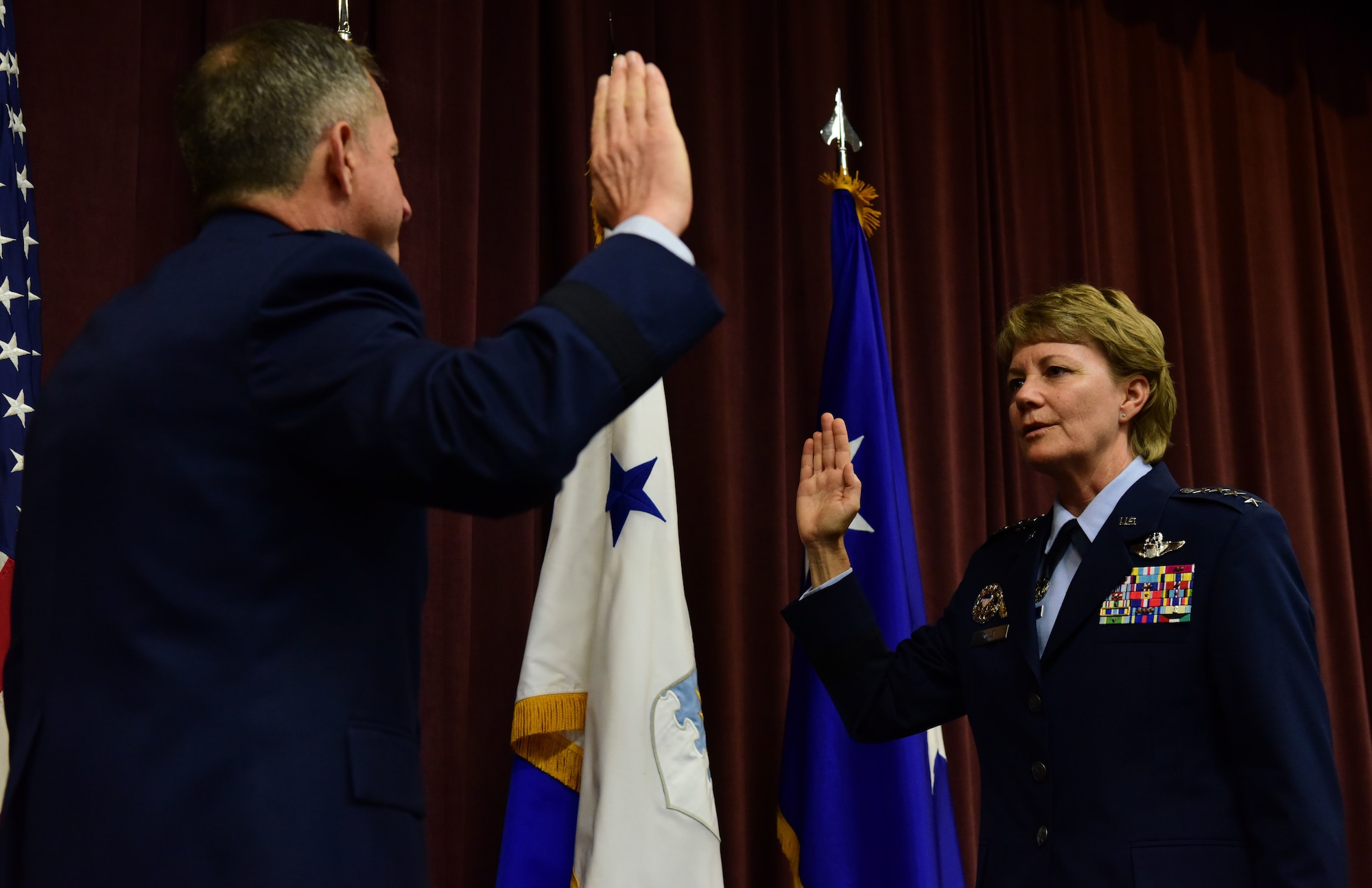 Gen. Maryanne Miller, incoming Air Mobility Command commander, receives the oath of office from Air Force Chief of Staff Gen. David L. Goldfein during a promotion ceremony at Scott Air Force Base, Illinois, Sept. 7, 2018. Previous to this assignment, Miller served as the commander of Air Force Reserve Command and chief of the Air Force Reserve. Miller became the first Reserve Airman to become a four-star general and the first Reserve Airman to command an Air Force major command outside of AFRC. AMC relies on a total force of more than 106,000 active-duty, Guard, Reserve, and civilian mobility professionals. (U.S. Air Force photo by Staff Sgt. Michael Cossaboom)