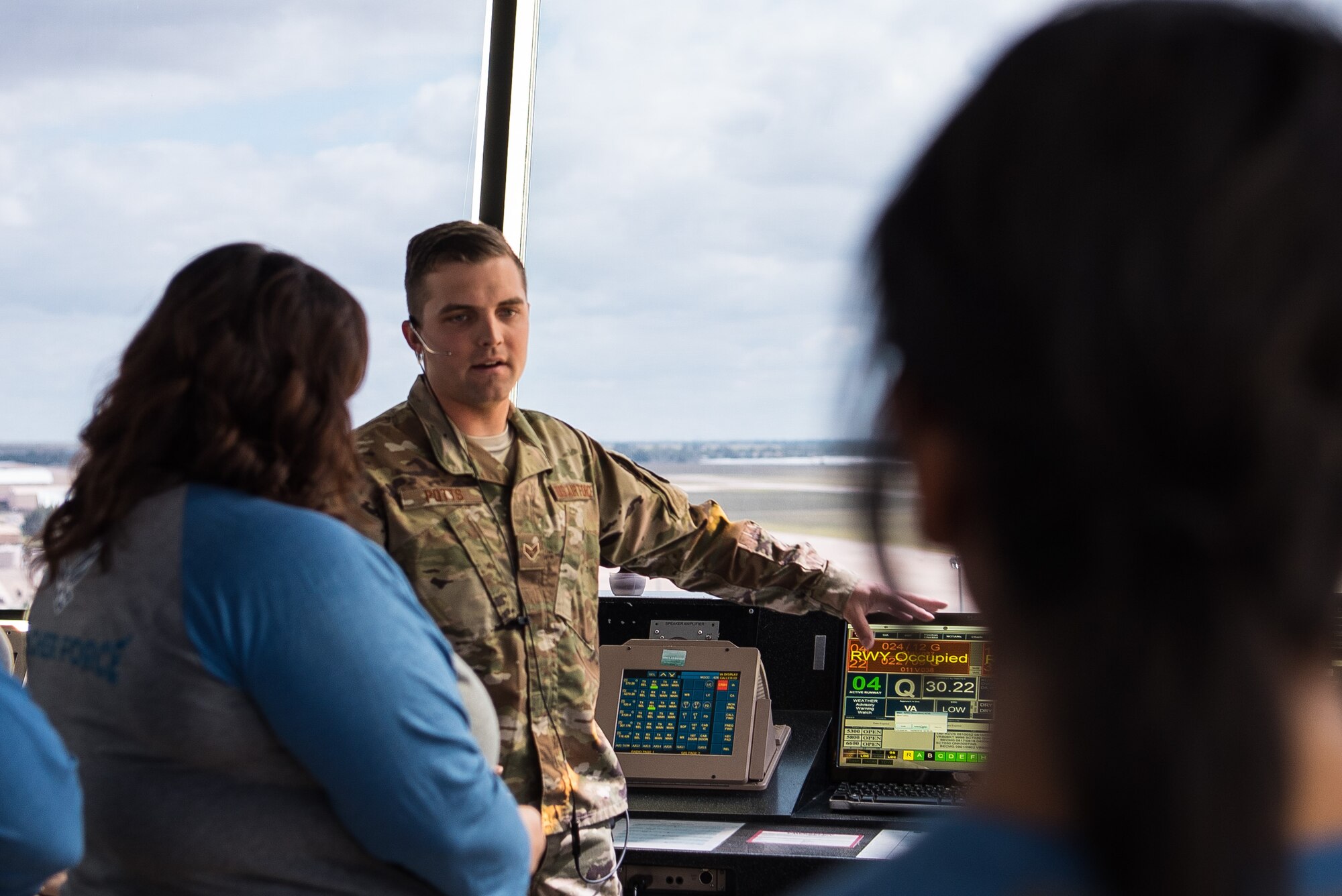 Senior Airman Christian Potts, 27th Special Operations Support Squadron air traffic control apprentice, what it takes to be an air traffic controller to teachers visiting Cannon Air Force Base, N.M., for the Teachers Understanding Deploy Operations program Sept. 8, 2018. The TUDOS program gave staff from local schools the chance to understand how Cannon AFB operates. (U.S. Air Force photo by Airman 1st Class Vernon R. Walter III/Released)