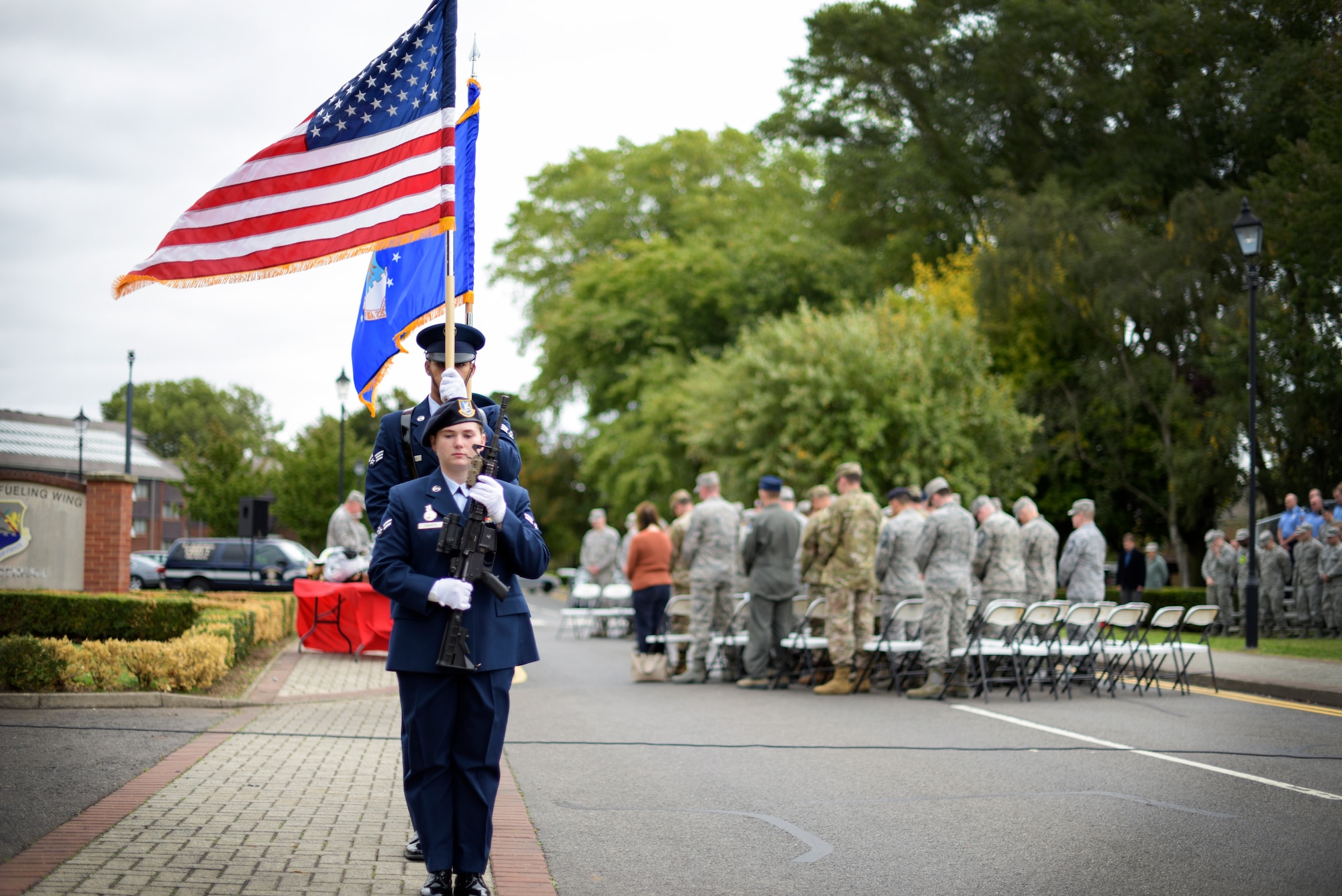 Members of the color guard march off after posting the colors, marking the beginning of a 9/11 ceremony at RAF Mildenhall Sept. 11, 2018. Team Mildenhall and the Liberty Wing leadership, Airmen and civilians formed the audience for the ceremony of remembrance (U.S. Air Force photo by Tech. Sgt. Emerson Nuñez)