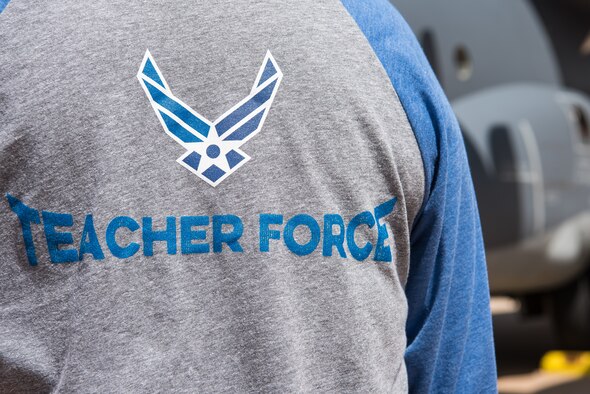 “Teacher Force” is displayed on the back of the shirts provided to local teachers during the Teachers Understanding Deployment Operations program at Cannon Air Force Base, N.M., Sept. 8, 2018. The TUDOS program gave staff from local schools the chance to understand a deployment works so they can support children of deployed military parents.. (U.S. Air Force photo by Airman 1st Class Vernon R. Walter III/Released)