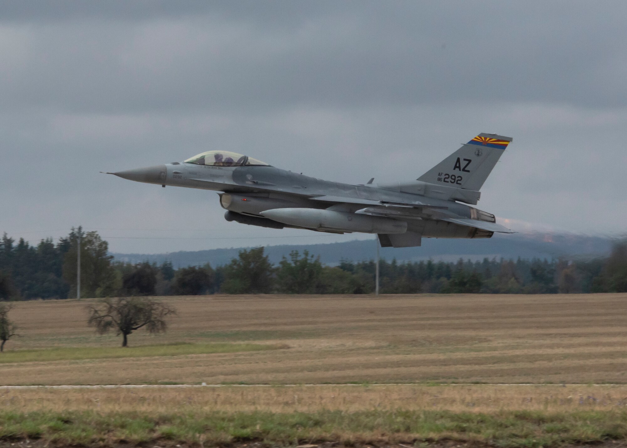 A U.S. Air Force F-16C Fighting Falcon, assigned to the 162nd Wing, Arizona Air National Guard, takes off from Namest Air Base, Czech Republic, for the start of Exercise Ample Strike 2018. Ample Strike is a Czech Republic led, multi-national live exercise that offers advanced air and land integration training to Joint Terminal Attack Controllers (JTACs) and Close Air Support (CAS) aircrews. The exercise highlights the United States and our NATO allies and partner nations commitment to defending the territorial integrity of Europe. (U.S. Air National Guard photo by Staff Sgt. George Keck)
