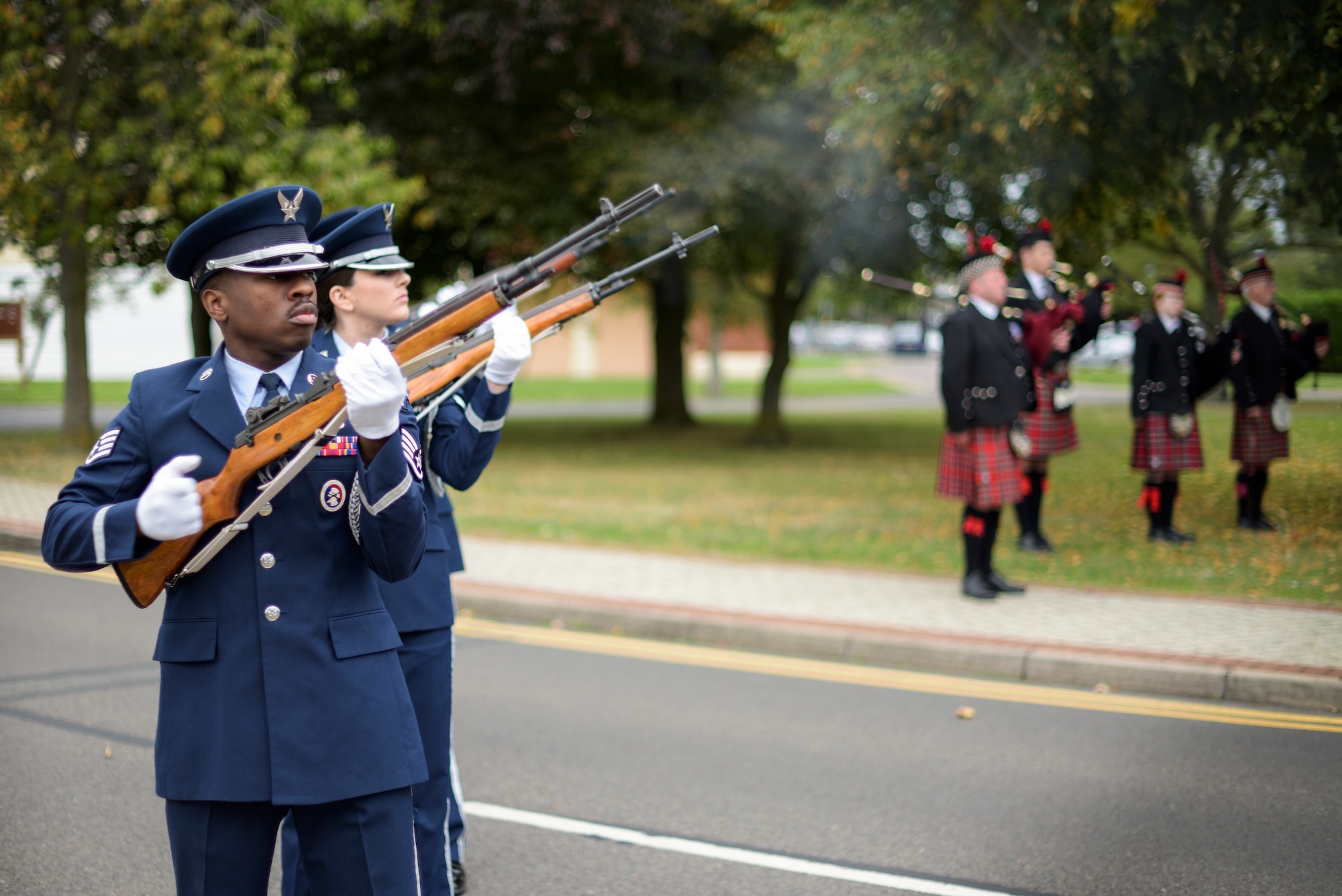 The Team Mildenhall Honor Guard fires a gun salute during a 9/11 ceremony at RAF Mildenhall Sep. 11, 2018. First responders from RAF Mildenhall and RAF Lakenheath attended the ceremony, which marked the 17th anniversary of the Sept. 11 terrorist attacks. (U.S. Air Force photo by Tech. Sgt. Emerson Nuñez)