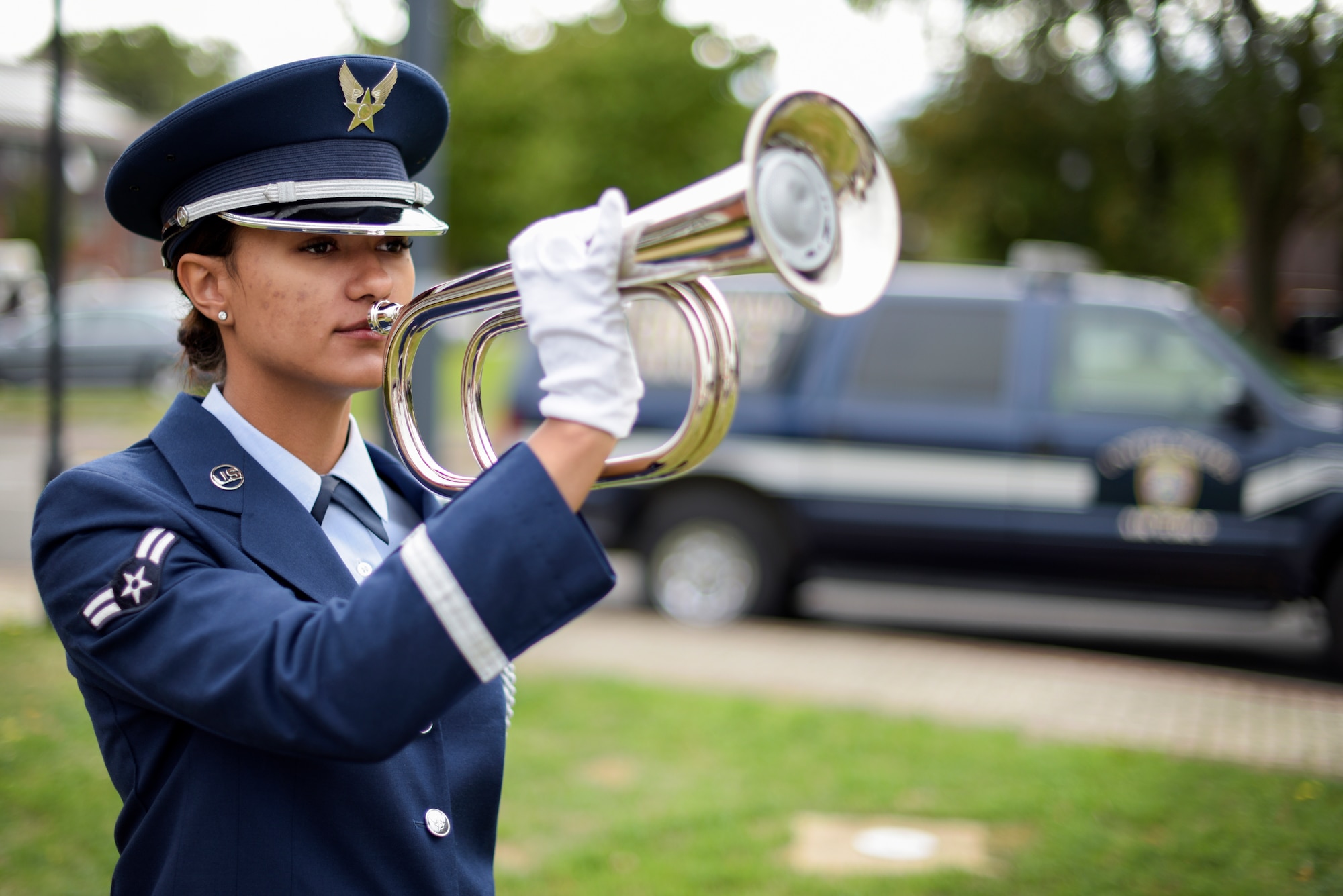 U.S. Air Force Airman 1st Class Tazesha Wilson, 100th Force Support Squadron finance clerk, plays Taps during a 9/11 ceremony at RAF Mildenhall Sep. 11, 2018. The ceremony marked the 17th anniversary of the Sept. 11 terrorist attacks. (U.S. Air Force photo by Tech. Sgt. Emerson Nuñez)