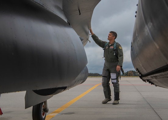 Colonel Allen Kinnison, 162nd Operations Group commander, Arizona Air National Guard, completes his pre-flight inspection of an F-16C Fighting Falcon at Namest Air Base, Czech Republic. Pilots accomplish a pre-flight inspection of each aircraft they will fly to ensure it is ready and safe for flight. Ample Strike is a Czech Republic led, multi-national live exercise that offers advanced air/land integration training to Joint Terminal Attack Controllers (JTACs) and Close Air Support (CAS) aircrews. The forward presence of the 162nd Wing, Arizona Air National Guard aircraft and Airmen in Europe allows the United States to work closely with our allies and partners to develop and improve interoperobility and maintain regional security. (U.S. Air National Guard photo by Staff Sgt. George Keck)