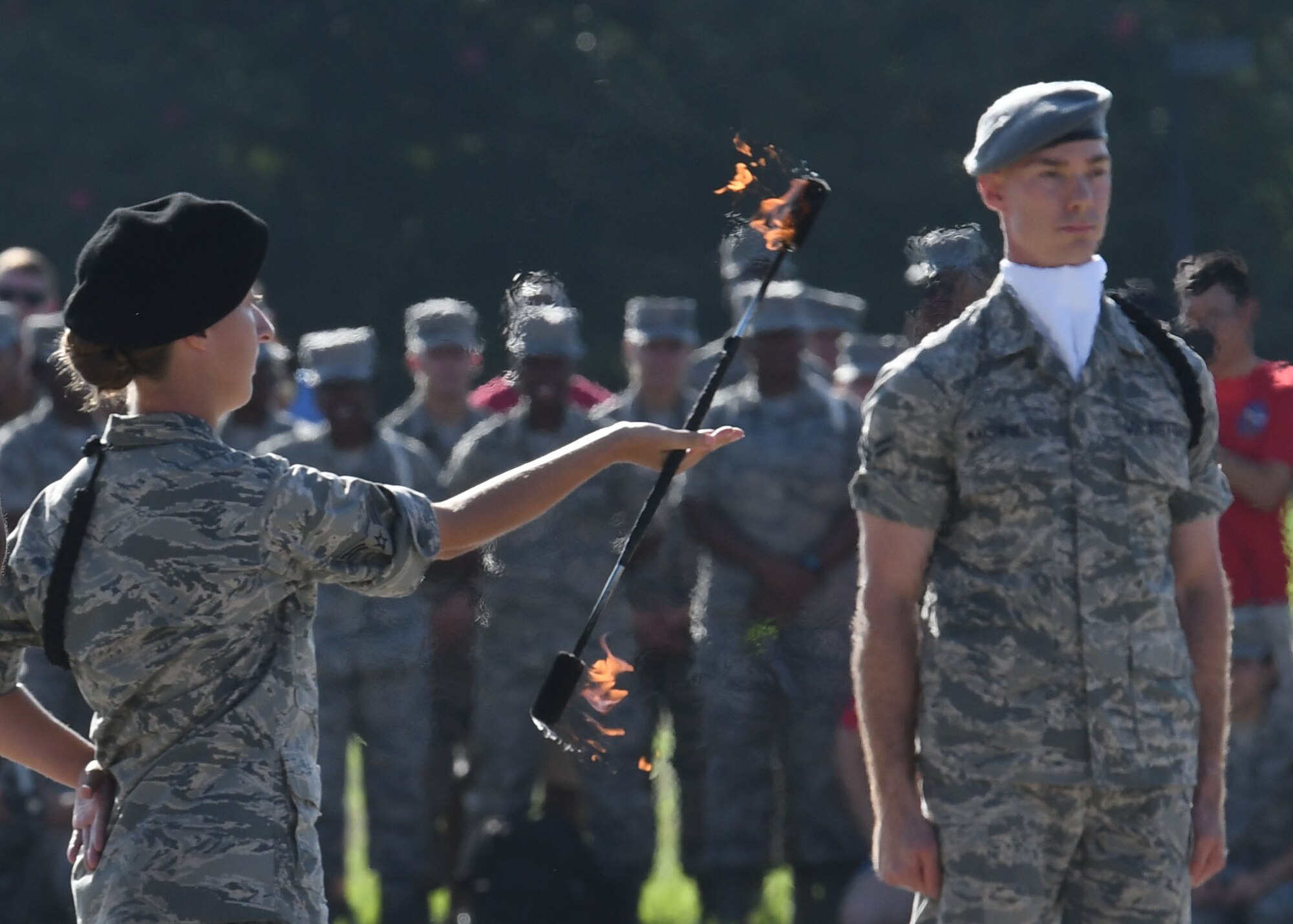 U.S. Air Force Airmen 1st Class Laura Hinson and Michael Makowski, 335th Training Squadron freestyle drill team members, perform during the 81st Training Group drill down on the Levitow Training Support Facility drill pad at Keesler Air Force Base, Mississippi, Sept. 7, 2018. Airmen from the 81st TRG competed in a quarterly open ranks inspection, regulation drill routine and freestyle drill routine. The 335th TRS "Bulls" took first place in each category this quarter. (U.S. Air Force photo by Kemberly Groue)