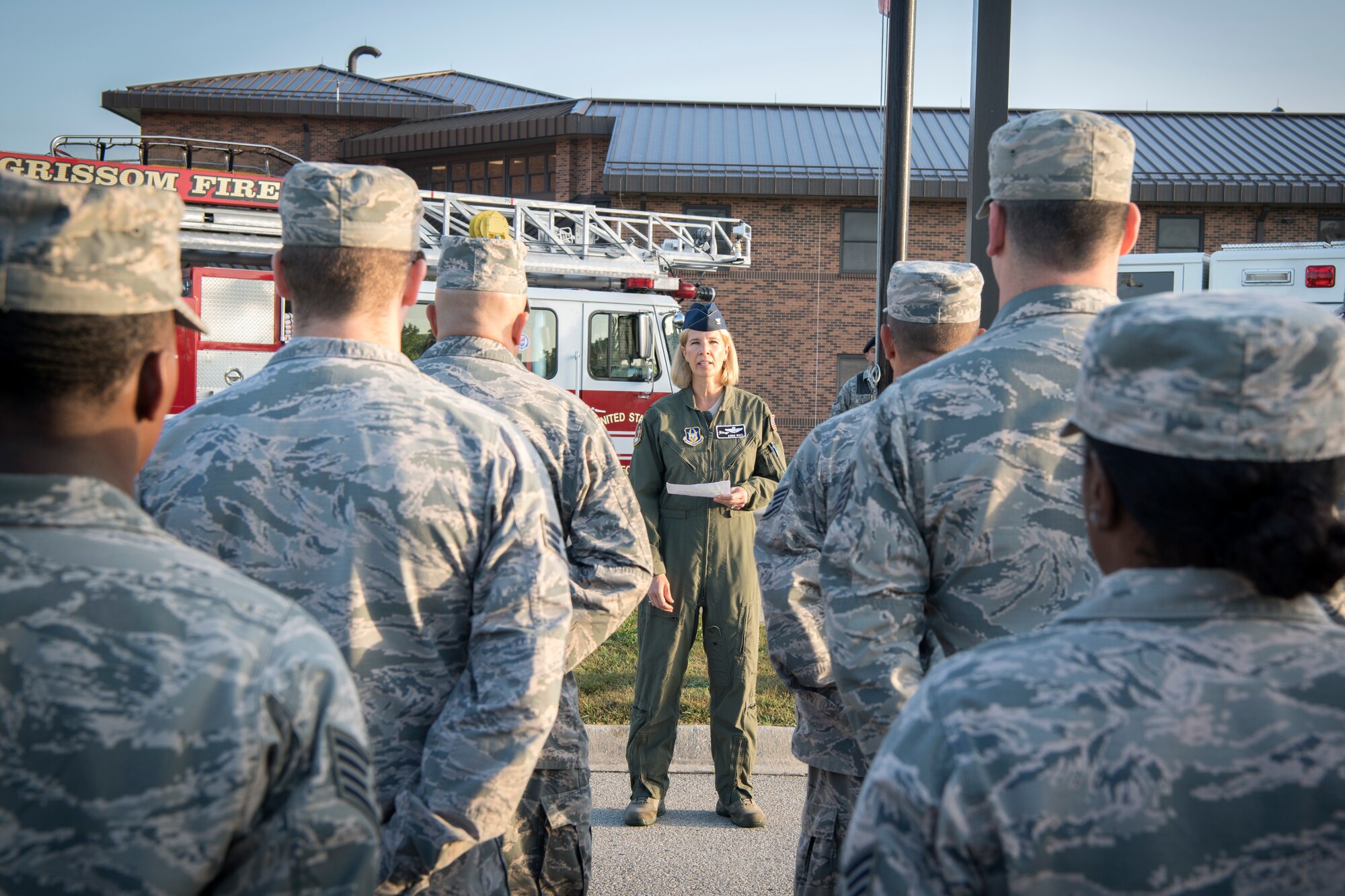 Col. Anne Noel, 434th Air Refueling Wing vice commander, speaks to Airmen during a 9/11 memorial ceremony at Grissom Air Reserve Base, Ind. Sept. 11, 2018. During the ceremony, more than 50 firemen, police, Airmen, NCOs, Officers, and civilians came together to pay their respects. (U.S. Air Force Photo/Tech. Sgt. Benjamin Mota)