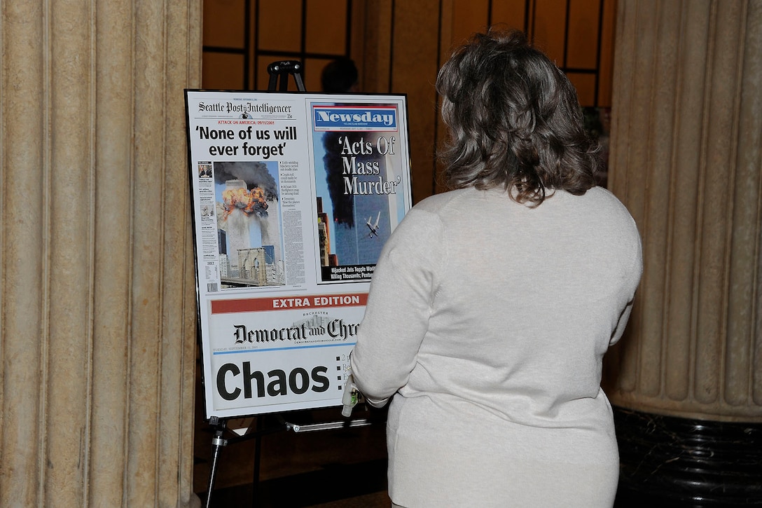 A Defense Logistics Agency employee reflects on the events of Sept. 11, 2001, at one of the historic displays.