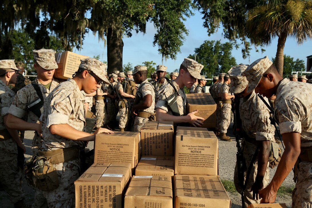 Marines pack boxes as the prepare to evacuate from a base in South Carolina.