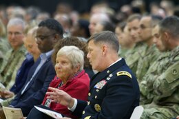 Fort Knox, Ky. - Maj. Gen Flem B. "Donnie" Walker Jr., commanding general, 1st Theater Sustainment Command, speaks with Wanda Wolosky, a Warsaw ghetto survivor and 2018 Days of Remembrance Commemoration Program keynote speaker, April 20, 2018.