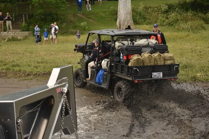 New York Army National Guard Sgt. 1st  Class Thomas Myers, from the 2nd Civil Support Team, drives an ATV off of New York Naval Militia  LC-350, a landing craft, at  Peebles Island State Park in Waterford, Sept. 8, 2018. Meyers and the 2nd CST conducted joint training with the Naval Militia to deploy a biological, chemical, and radiological survey team using the Naval Militia's new LC-350.