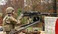 Sgt. Austin Ball, a network assurance noncommissioned officer for the 1st Theater Sustainment Command, fires a M2 .50-caliber machine gun Nov. 6 at Heins Range