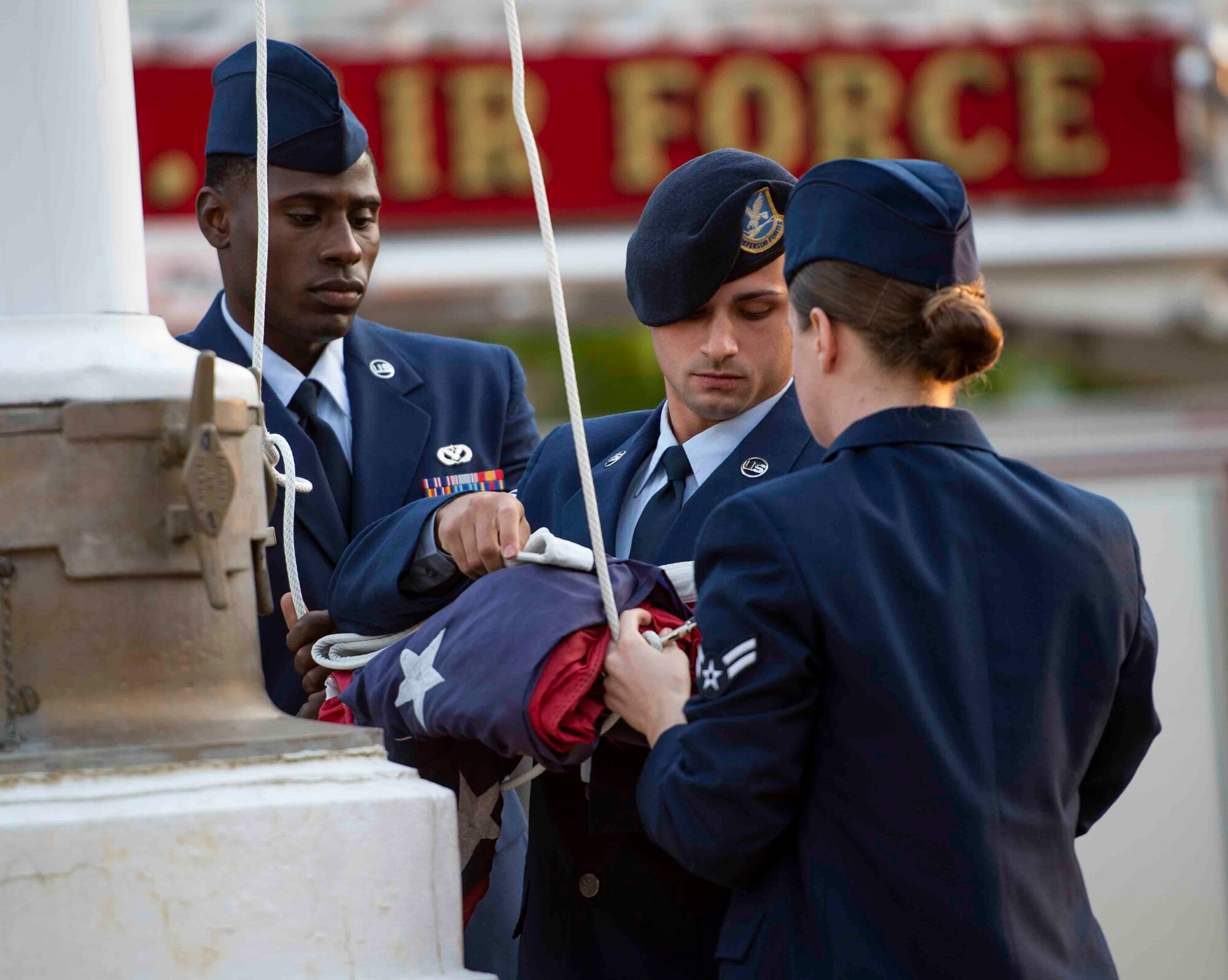 Airman Leadership School students raise the flag during a 9/11 memorial ceremony, Sept. 11, 2018, at Scott Air Force Base, Illinois. The flag was flown at half-staff in recognition of Patriot Day, a national day of mourning meant to honor the 2,996 victims of the 2001 terrorist attacks. (U.S. Air Force photo by Airman 1st Class Tara Stetler)