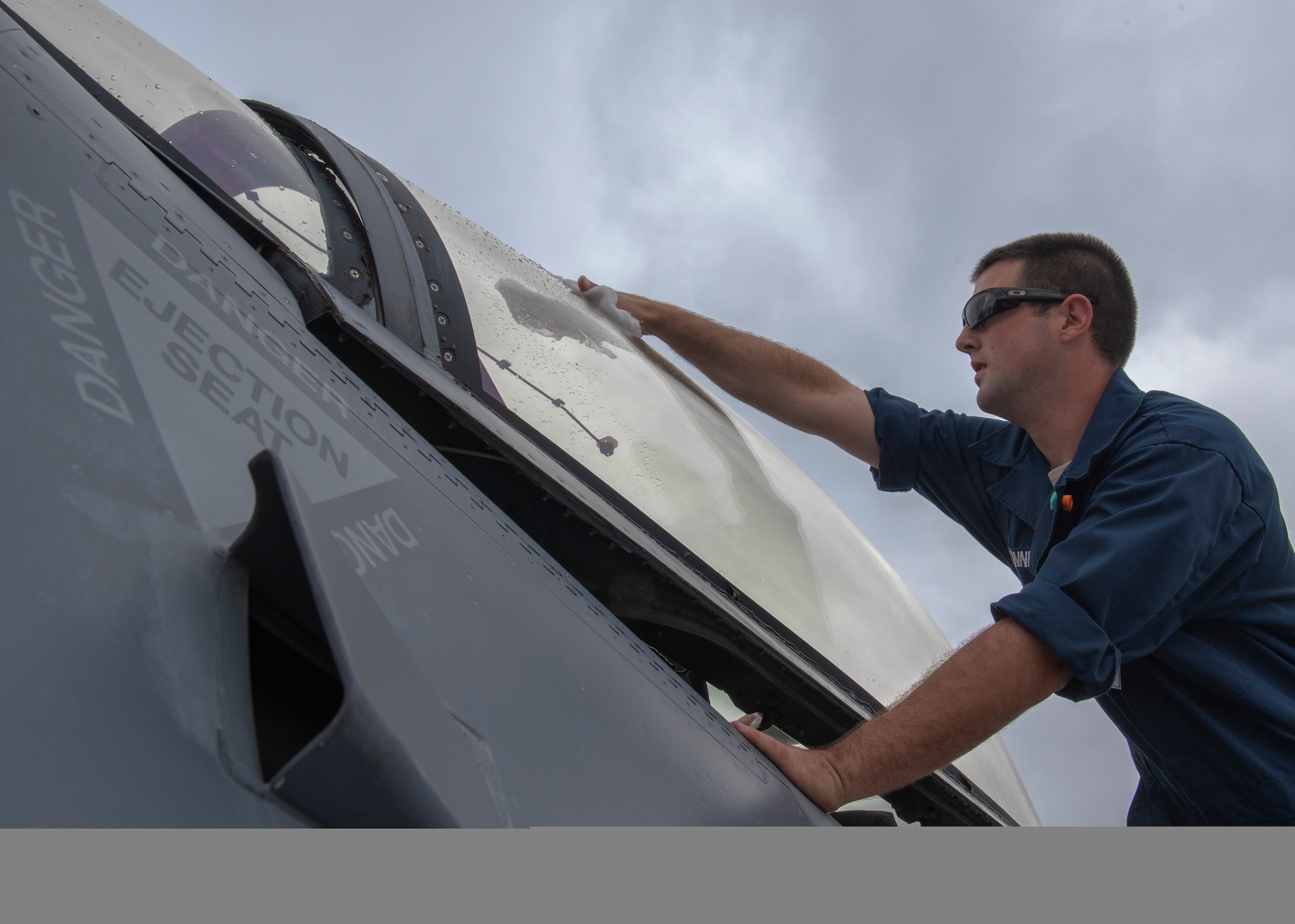 Staff Sgt. Jacob Bonner, a 162nd Wing egress technician, Arizona Air National Guard, cleans the canopy of an F-16C Fighting Falcon at Namest Air Base, Czech Republic. Maintainers clean the aircraft canopy before each sortie to ensure the pilot has a clean line of sight while flying. Ample Strike is a Czech Republic led, multi-national live exercise that offers advanced air/land integration training to Joint Terminal Attack Controllers (JTACs) and Close Air Support (CAS) aircrews. The aircraft maintenance accomplished by the maintainers enable the United States forces’ to respond quickly to support and defend our allies. (U.S. Air National Guard photo by Staff Sgt. George Keck)