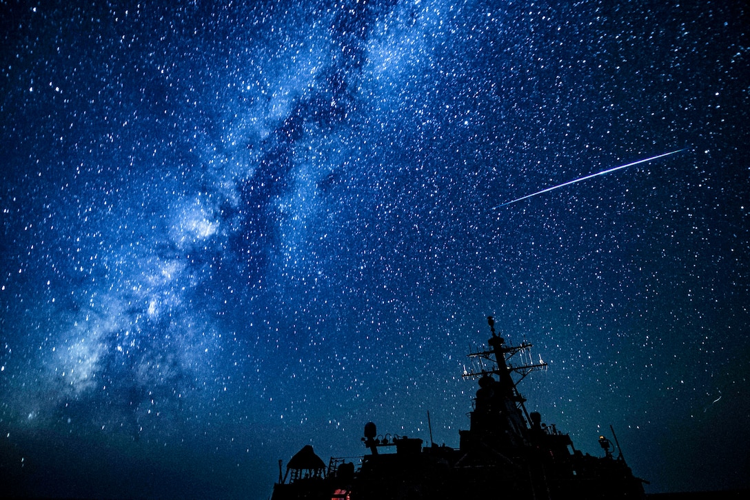 The USS Carney travels across the Mediterranean Sea at night.