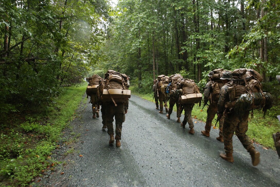 Marines with Marine Barracks Washington D.C. hike with their packs during Fire Team Leaders Course at Marine Corps Base Quantico, Va., Sept. 9, 2018. The course is comprised of multiple live-fire events utilizing numerous weapons systems, patrols and defensive and offensive drills. It is a course designed to strengthen small unit leadership amongst the Marines to prepare them for the Fleet Marine Forces, while focusing on refining their infantry skills. This year marks the fourth iteration of the Fire Team Leaders Course.