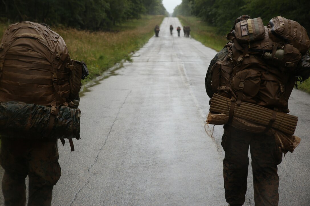 Marines with Marine Barracks Washington D.C. hike with their packs during Fire Team Leaders Course at Marine Corps Base Quantico, Va., Sept. 9, 2018. The course is comprised of multiple live-fire events utilizing numerous weapons systems, patrols and defensive and offensive drills. It is a course designed to strengthen small unit leadership amongst the Marines to prepare them for the Fleet Marine Forces, while focusing on refining their infantry skills. This year marks the fourth iteration of the Fire Team Leaders Course.