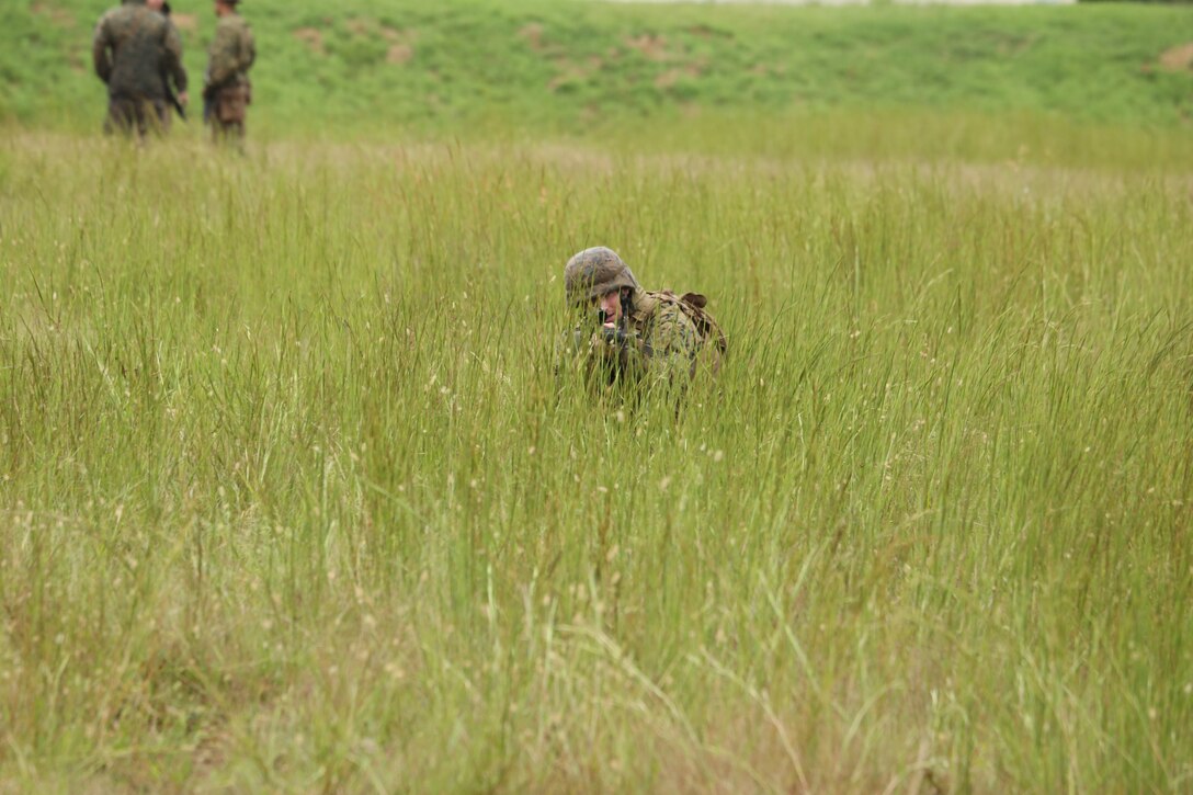 A Marine with Marine Barracks Washington D.C. aims at a target during a dry run training exercise for the Fire Team Leaders Course at Marine Corps Base Quantico, Va., Sept. 9, 2018. The course was comprised of multiple live-fire events utilizing numerous weapons systems, patrols and defensive and offensive drills. It is a course designed to strengthen small unit leadership amongst the Marines to prepare them for the Fleet Marine Forces, while focusing on refining their infantry skills.