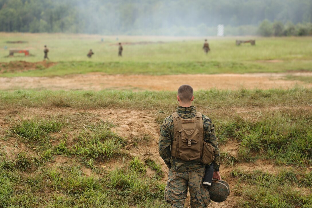 Corporal Keegan A. McGuirt, 2nd Platoon, Bravo Company, Marine Barracks Washington D.C., observes a live-fire training exercise for the Fire Team Leaders Course at Marine Corps Base Quantico, Va., Sept. 10, 2018. The course was comprised of multiple live-fire events utilizing numerous weapons systems, patrols and defensive and offensive drills. It is a course designed to strengthen small unit leadership amongst the Marines to prepare them for the Fleet Marine Forces, while focusing on refining their infantry skills.