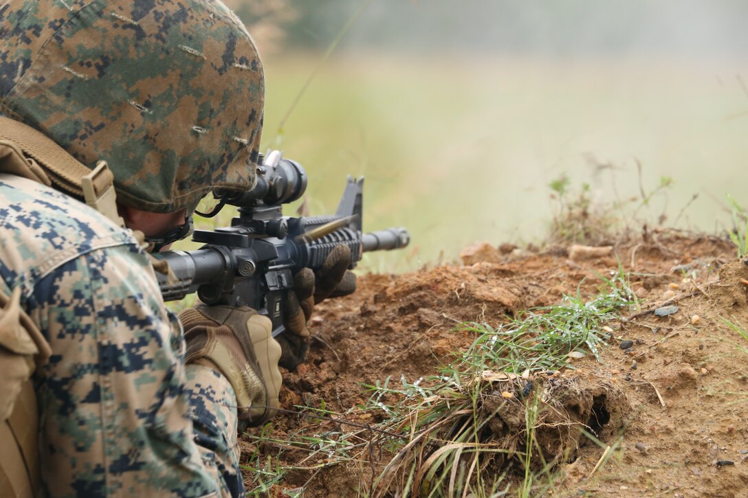 A Marine with Marine Barracks Washington D.C. fires rounds from an M16A4 during a live-fire training exercise for the Fire Team Leaders Course at Marine Corps Base Quantico, Va., Sept. 10, 2018. The course was comprised of multiple live-fire events utilizing numerous weapons systems, patrols and defensive and offensive drills. It is a course designed to strengthen small unit leadership amongst the Marines to prepare them for the Fleet Marine Forces, while focusing on refining their infantry skills.