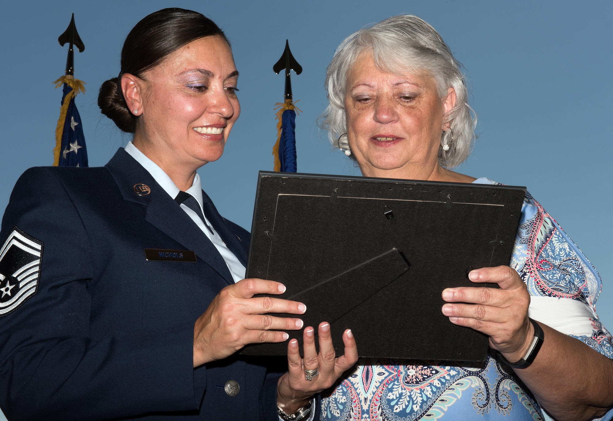 U.S. Air Force Chief Master Sgt. Steve Nichols, 60th Air Mobility Wing command chief and his spouse Senior Master Sgt. Angell Nichols, 60th Operations Support Squadron retire together in a duel ceremony at Travis Air Force Base, Calif., September 7, 2018. (U.S. Air Force photo by Louis Briscese)