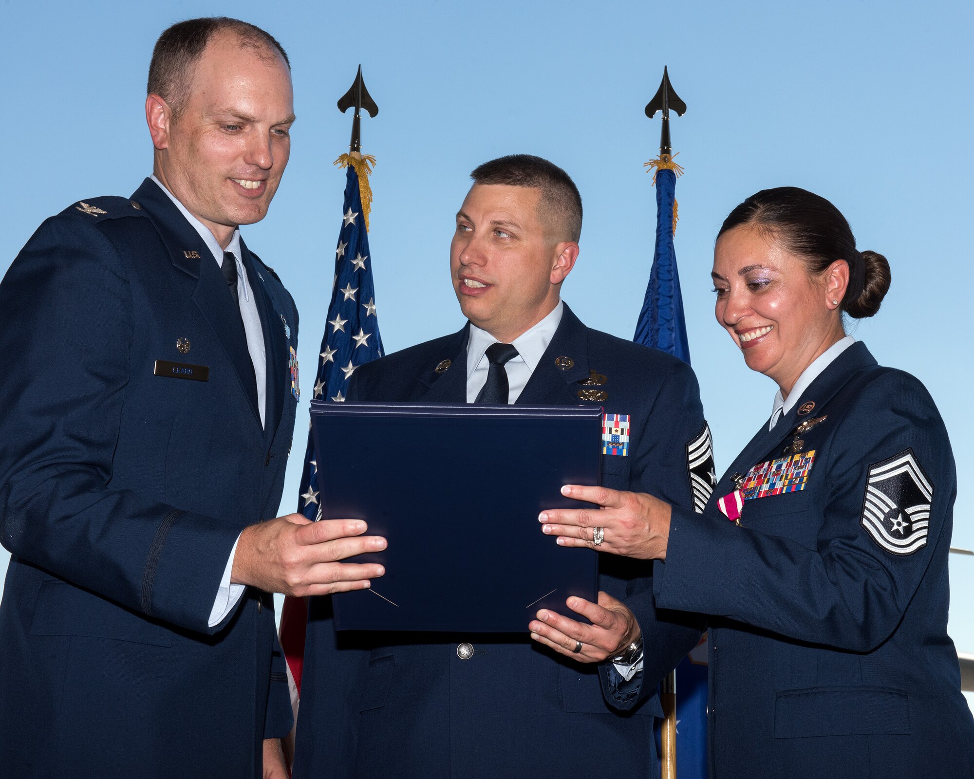 U.S. Air Force Chief Master Sgt. Steve Nichols, 60th Air Mobility Wing command chief and his spouse Senior Master Sgt. Angell Nichols, 60th Operations Support Squadron retire together in a duel ceremony at Travis Air Force Base, Calif., September 7, 2018. (U.S. Air Force photo by Louis Briscese)