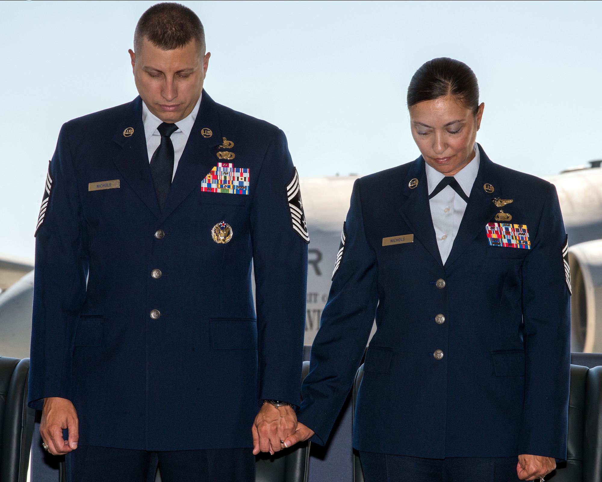 U.S. Air Force Chief Master Sgt. Steve Nichols, 60th Air Mobility Wing command chief and his spouse Senior Master Sgt. Angell Nichols, 60th Operations Support Squadron retire together in a duel ceremony at Travis Air Force Base, Calif., September 7, 2018. (U.S. Air Force photo by Louis Briscese)