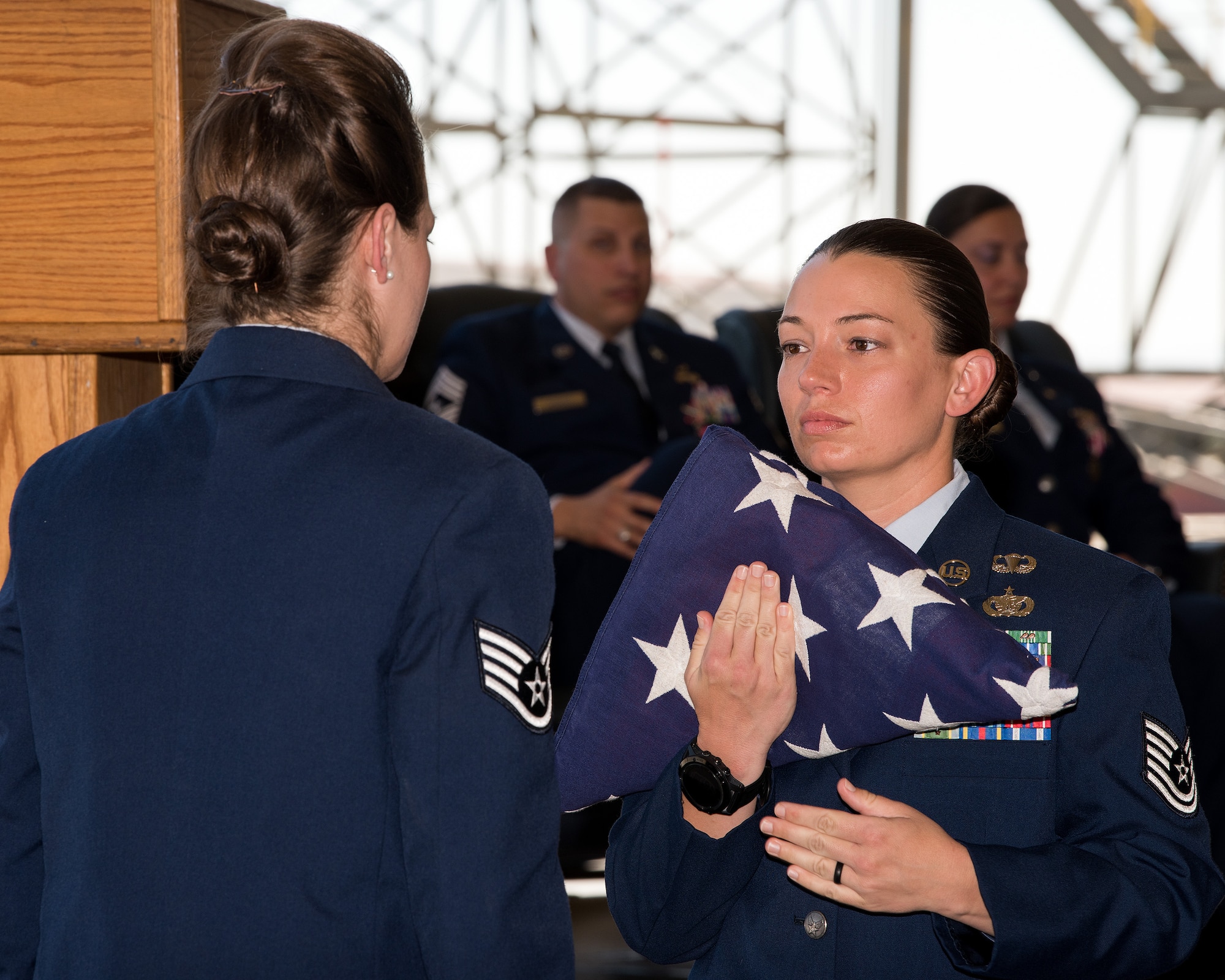 U.S. Air Force Chief Master Sgt. Steve Nichols, 60th Air Mobility Wing command chief and his spouse Senior Master Sgt. Angell Nichols, 60th Operations Support Squadron retire together in a duel ceremony at Travis Air Force Base, Calif., September 7, 2018. (U.S. Air Force photo by Louis Briscese)