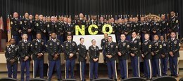 FORT KNOX, Ky. – Noncommissioned (NCO) Soldiers from the 1st Theater Sustainment Command stand together for a group photo during the 2018 NCO Symposium, Aug 28-30, at the Gen. George Patton Museum. The symposium allowed for professional open-forum discussion amongst the NCO ranks. (U.S. Army photo by Spc. Zoran Raduka)