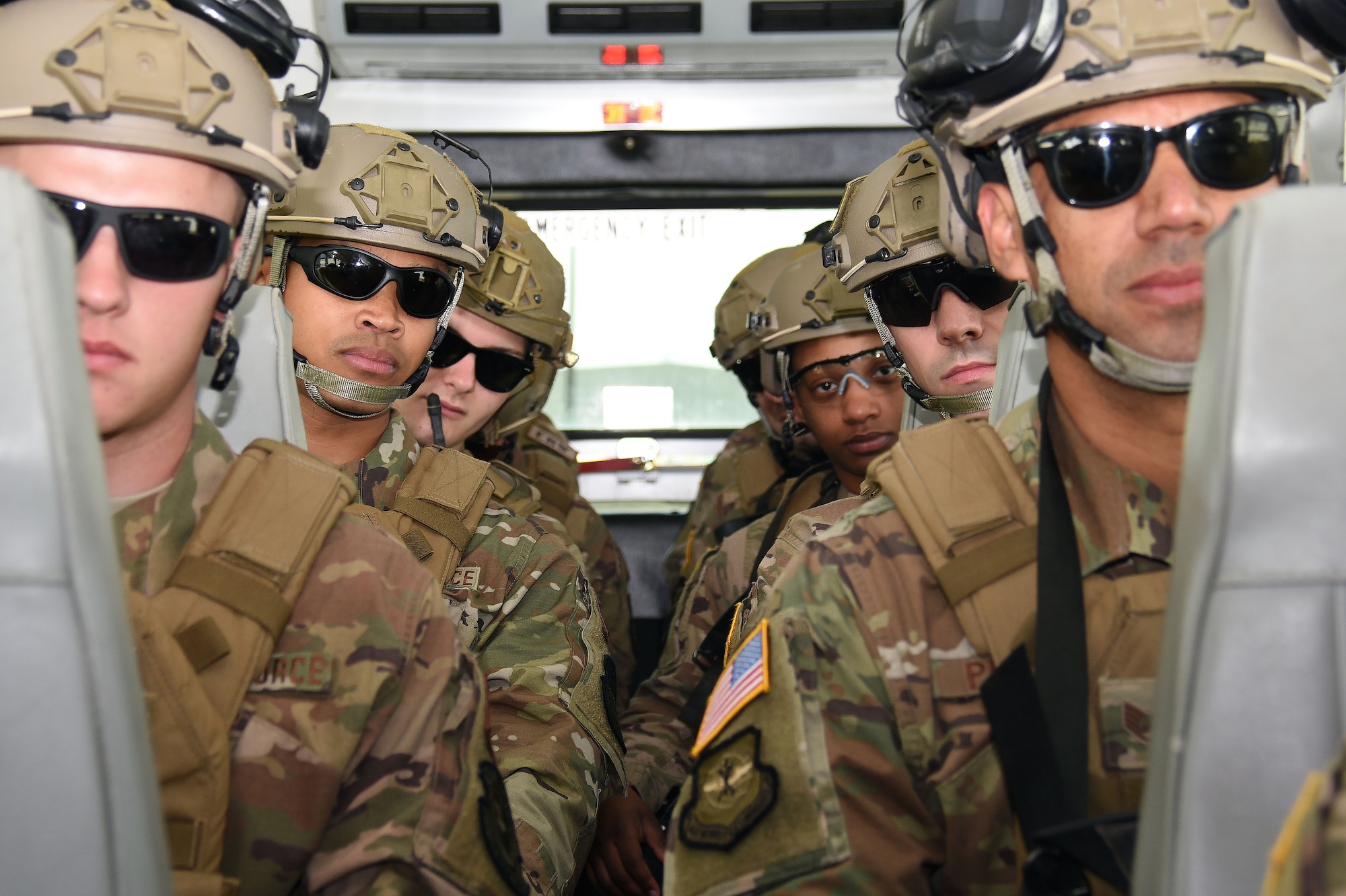 Airmen with the 621st Contingency Response Wing await bus transport to the designated exercise area as part of Exercise Turbo Distribution, Sept. 8, 2018, at Fort McCoy, Wis. The exercise helped to hone the Airmen's core port-opening competencies as well as provide upgrade training for participating Airmen. (U.S. Air Force photo by Airman 1st Class christian Conrad)