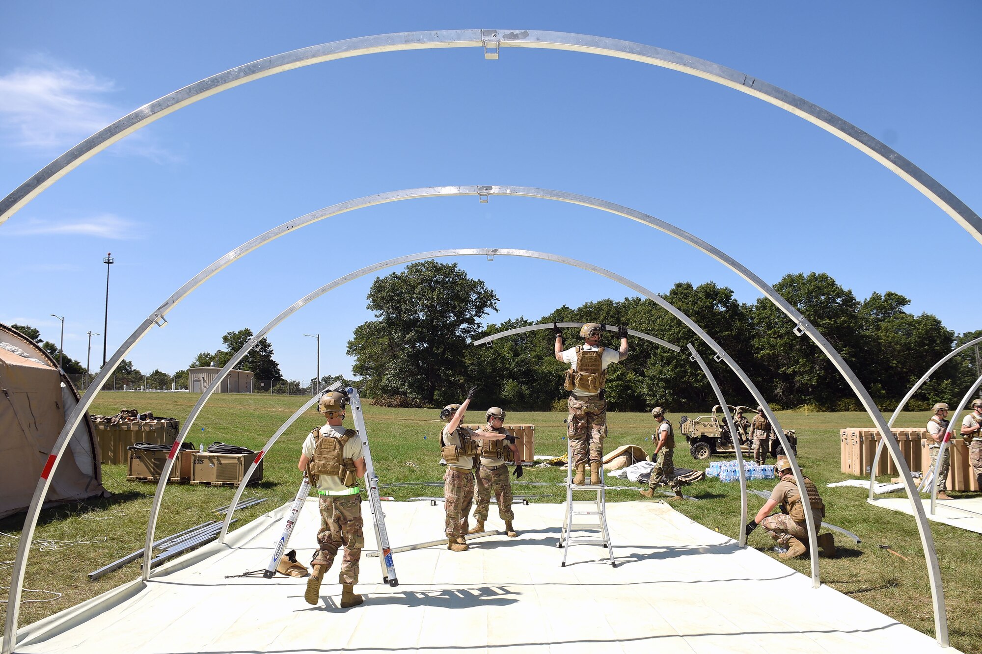 Airmen with the 621st Contingency Response Wing work to build tents during Exercise Turbo Distribution 18-02 Sept. 8, 2018, at Fort McCoy, Wis. The exercise helped to hone the Airmen's core port-opening competencies as well as provide upgrade training for the participating Airmen. (U.S. Air Force photo by Airman 1st Class Christian Conrad)