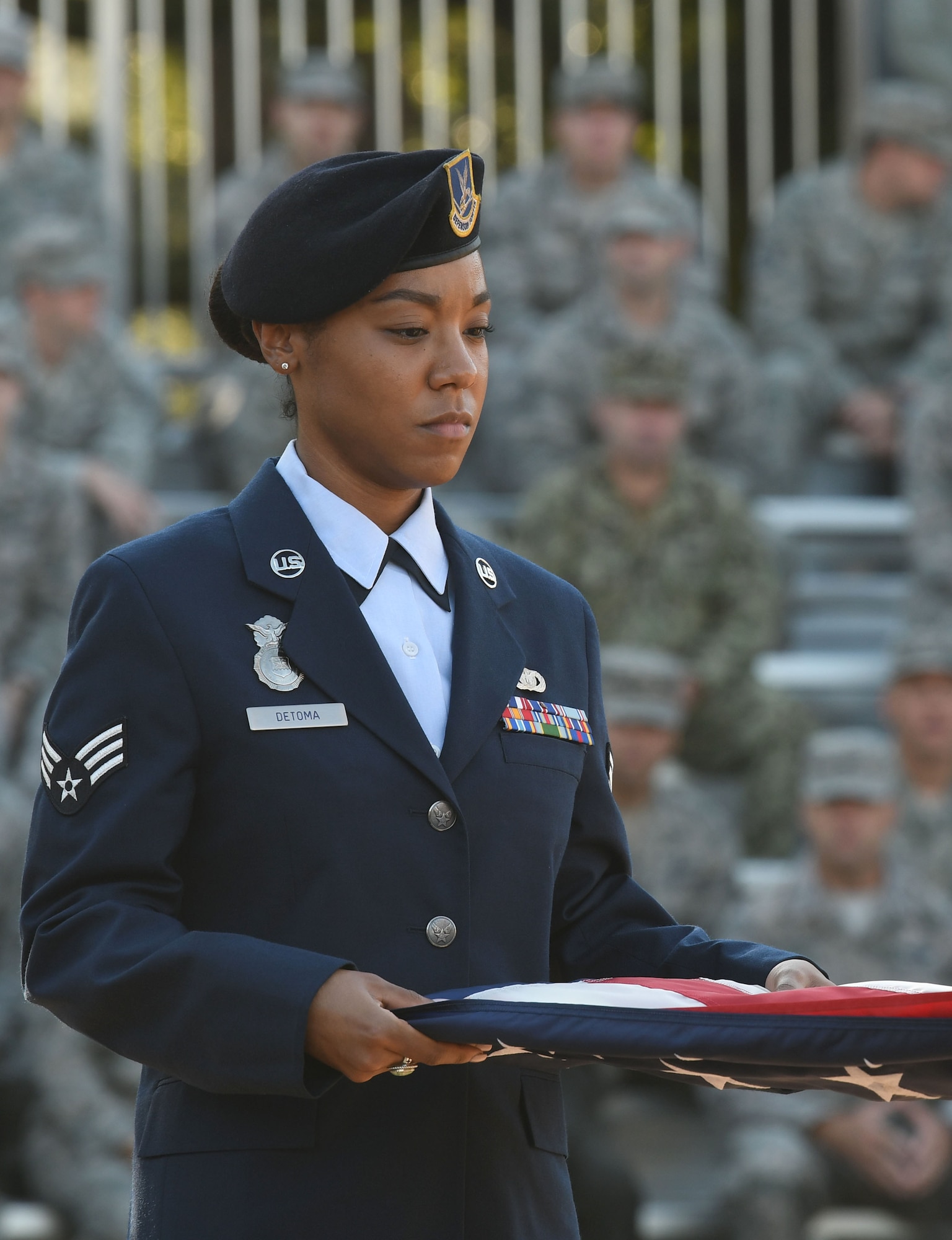 U.S. Air Force Senior Airman Jexsira Detoma, 81st Security Forces Squadron patrolman, participates in a 9/11 ceremony in front of the 81st Training Wing headquarters building at Keesler Air Force Base, Mississippi, Sept. 11, 2018. The event, attended by Keesler Airmen, Sailors, Marines and civilians, honored those who lost their lives during the 9/11 attacks. (U.S. Air Force photo by Kemberly Groue)