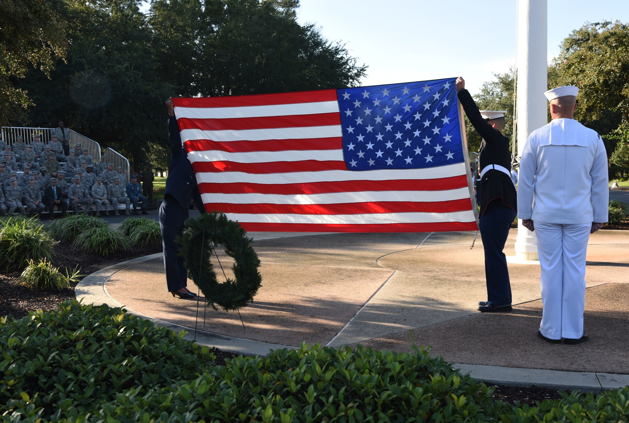 Keesler Airmen, Sailors and Marines participate in a 9/11 memorial ceremony in front of the 81st Training Wing headquarters building at Keesler Air Force Base, Mississippi, Sept. 11, 2018. The event honored those who lost their lives during the 9/11 attacks. (U.S. Air Force photo by Kemberly Groue)